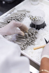Cannabis white label partner production facility applying compliant labels and packaging